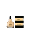 Dropper of The Honey Collection Regenerating Honey Serum for face, showing golden serum in a clear glass bottle with a dropper.