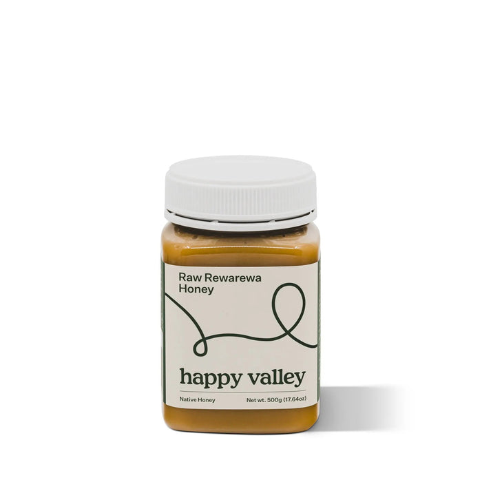 Jar of Rewarewa native honey from Happy Valley Honey, showcasing rich, golden raw honey with Rewarewa flower nectar.