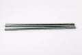Set of three durable zinc-coated metal poles, designed for outdoor use and easy assembly.