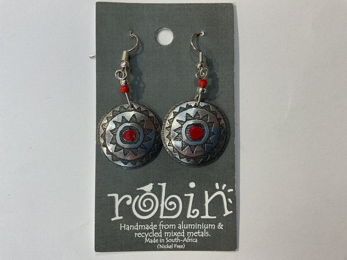 A pair of silver-colored earrings with red and black patterns, made from recycled metals, displayed on a card with 'Robin' branding.