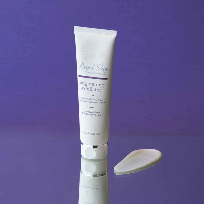 Happy Valley Honey Royal Skin Brightening Exfoliator in a white tube with a silver cap, featuring natural ingredients and skincare benefits.