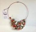 Decorative necklace with a 'Serendipity by Jayne' tag on a white background