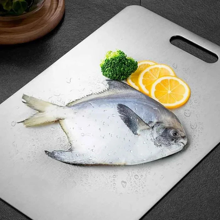 Stainless steel ShopHub NZ chopping board, durable and sleek for food prep and slicing.