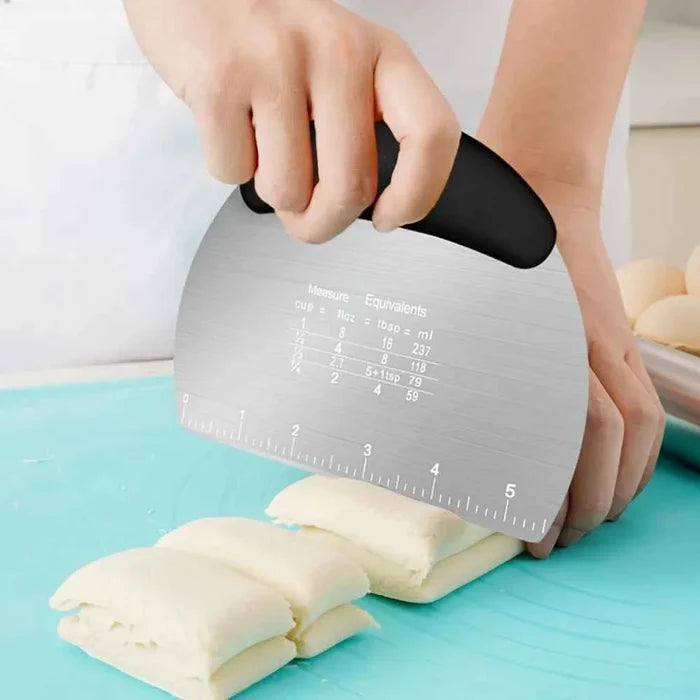 Stainless steel dough scraper cutter with handle, used for kneading and dividing dough in baking and cooking.
