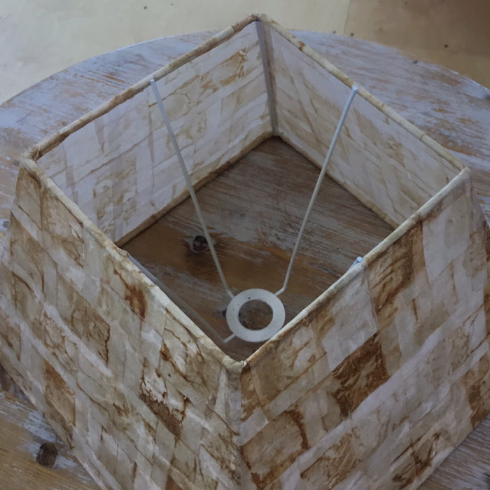 top of a lampshade made from tea bags