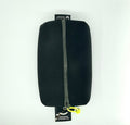 A black case with a zipper, made from upcycled materials, with a yellow tag and a label that includes the text 'The Upcycle Movement'.