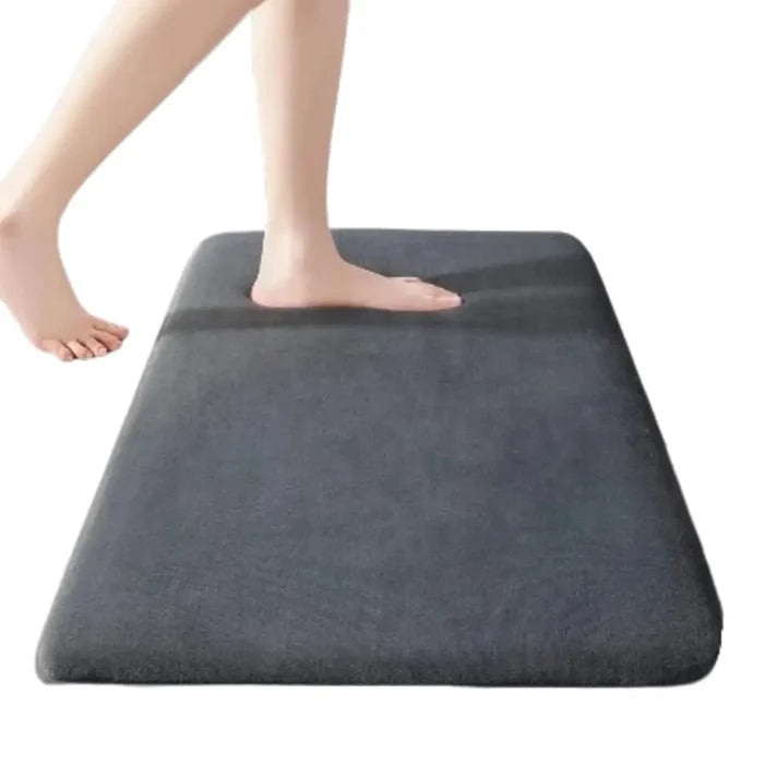 Habicare thick absorbent bathroom mat in solid color with non-slip backing, designed for bathroom floors or doors.