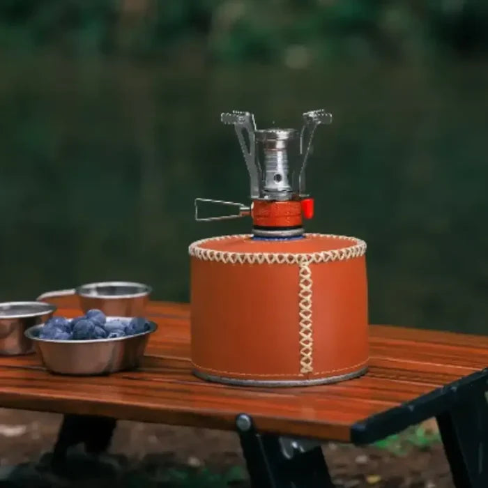 Habicare ultra-light foldable gas stove for camping and hiking, compact stainless steel design with portable features.