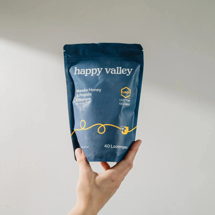 Happy Valley Honey UMF 10+ Manuka Honey and Propolis lemon lozenges in a clear package, showcasing the natural ingredients and lemon flavor.