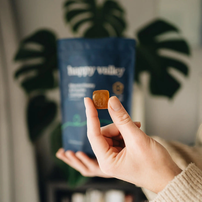 UMF 10+ Manuka Honey and Propolis peppermint lozenges by Happy Valley Honey, showing a close-up of the lozenges in a package.