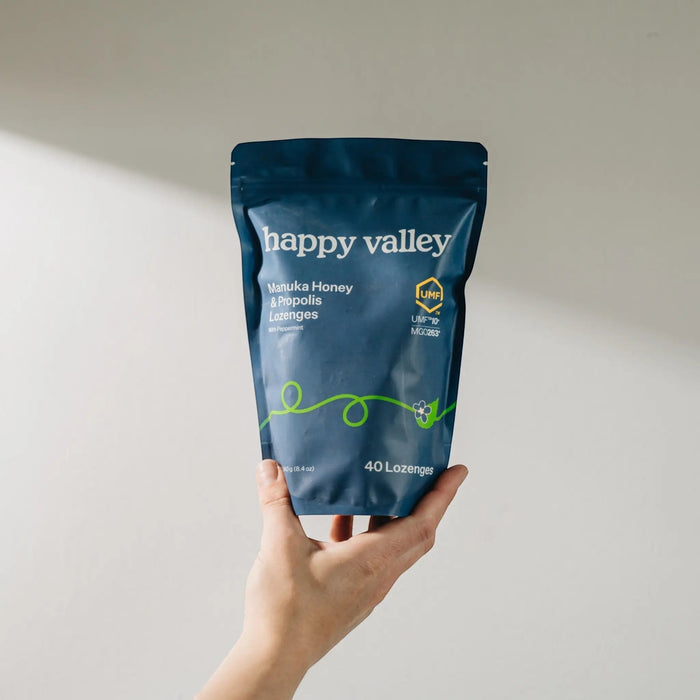 Happy Valley Honey UMF 10+ Manuka Honey and Propolis Peppermint Lozenges, showing the package with lozenges and branding.