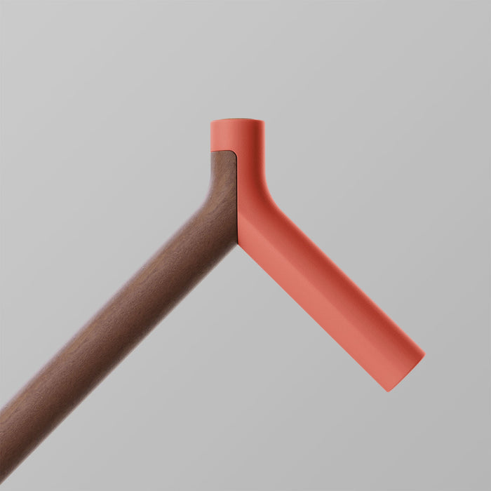 Ooak Uno walking stick with coral and walnut wood, featuring a triangular design and ergonomic handle.