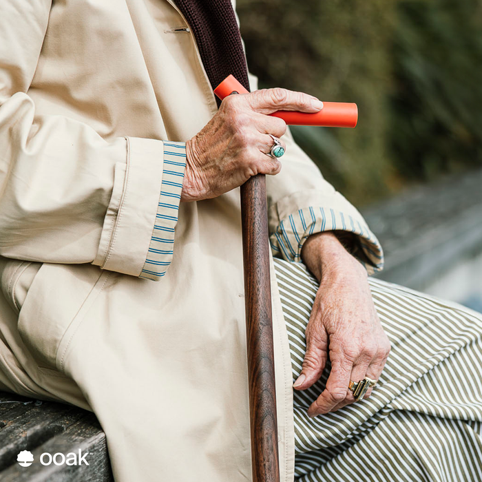 Ooak Coral and Walnut walking stick with a polished coral handle and walnut shaft, featuring a square water-themed design.