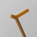 OOAK Uno walking stick with Kōwhai yellow and oak wood handle, featuring natural wood grain and handcrafted details.