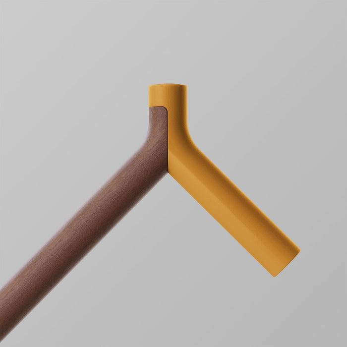 OOAK Uno walking stick with Kōwhai and Walnut wood, featuring a triangle design and ergonomic handle.