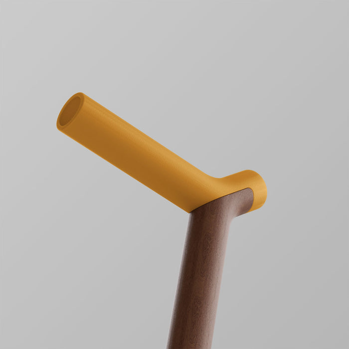 Ooak Uno walking stick with Kōwhai handle and walnut shaft, featuring a natural wood finish and ergonomic design.