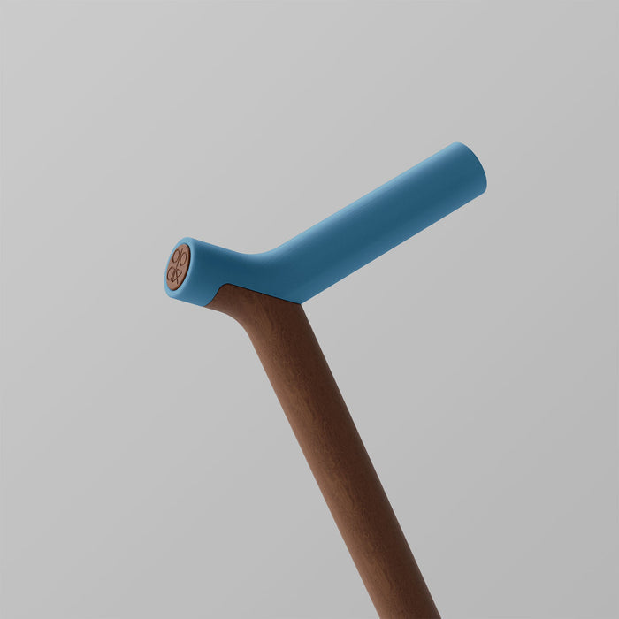 Ooak Uno walking stick featuring walnut wood handle and Pacific-colored shaft with a sleek design.
