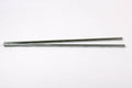 Two silver stainless steel chopsticks, sleek design, perfect for dining.