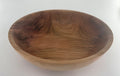 Wooden bowl with a natural finish on a white background