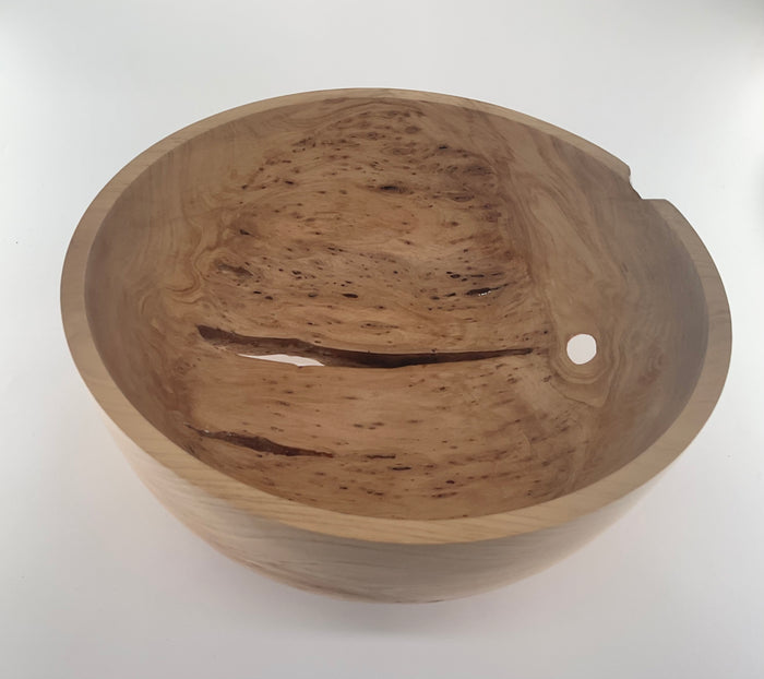 Wooden bowl with a smooth finish on a white background