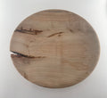 Round wooden plate on a white background