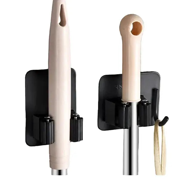 Stainless steel wall-mount mop and broom holder by Habicare with multiple slots for organizing cleaning tools.