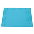 Watch repair electronics mat by That Watch Shop with watch tools and compartments for safe handling of watch components.