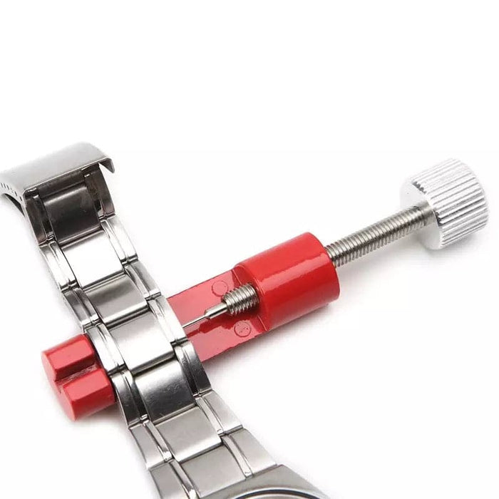 Red watch link remover tool from That Watch Shop, designed for adjusting watch band links with precision and ease.