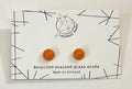 Recycled stained glass stud earrings on a WildBird Studio card.