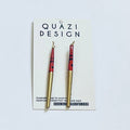 Pair of earrings on a Quazi Design card with a white background