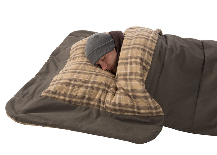 Cozy plaid sleeping bag with brown lining, perfect for camping and outdoor adventures.