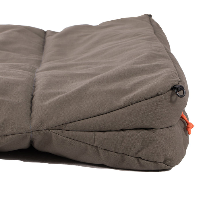 Comfortable brown camping pad, durable cotton fabric with orange strap, perfect for outdoor relaxation.