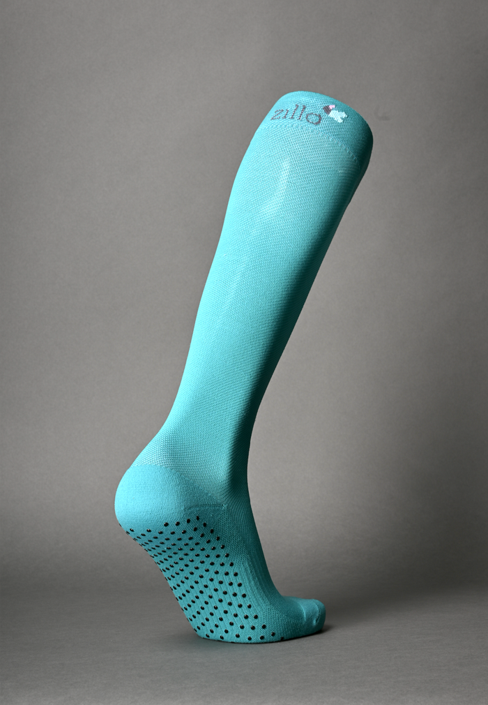 Zillo Explorer Travel Compression Sock by ZilloPillow, white with blue accents, designed for comfortable support during travel.
