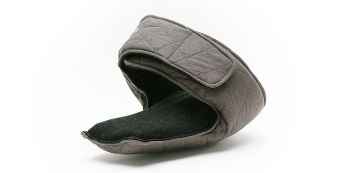 ZilloPillow travel pillow in soft fabric, designed for neck support during journeys, with a compact, ergonomic shape.